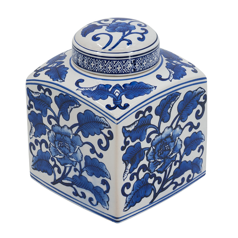 Square white ceramic canister with blue floral patterns and a matching round lid.