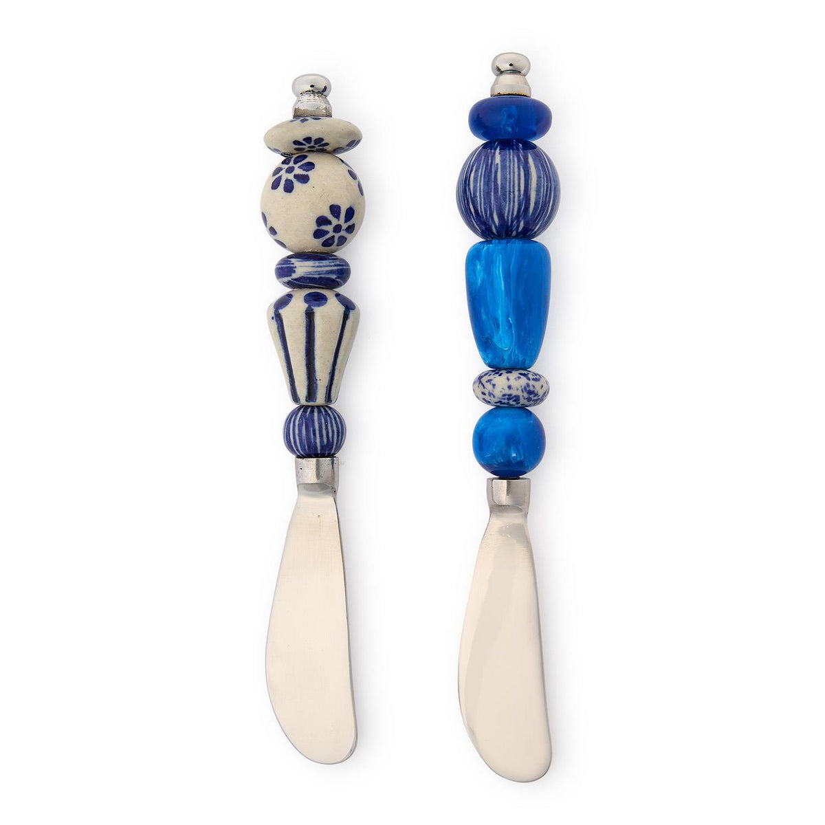 Two stainless steel spreaders with decorative blue and white ceramic and resin beaded handles.