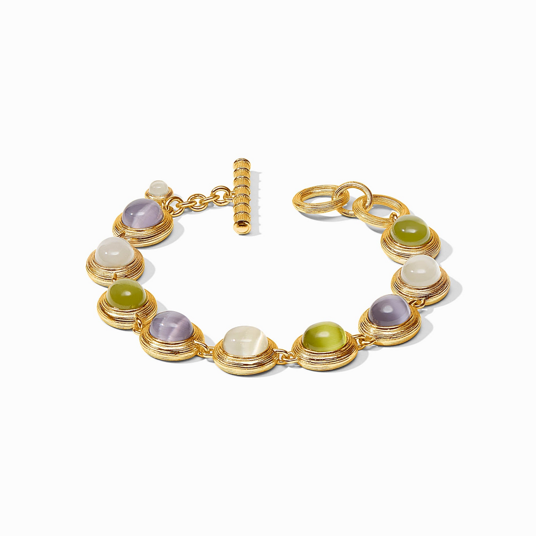 Gold cobblestone tennis bracelet with purple, green, and white glass stones and a toggle closure.
