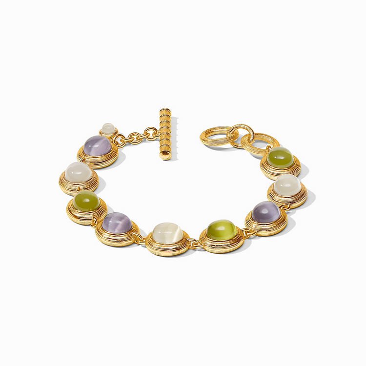 Gold cobblestone tennis bracelet with purple, green, and white glass stones and a toggle closure.