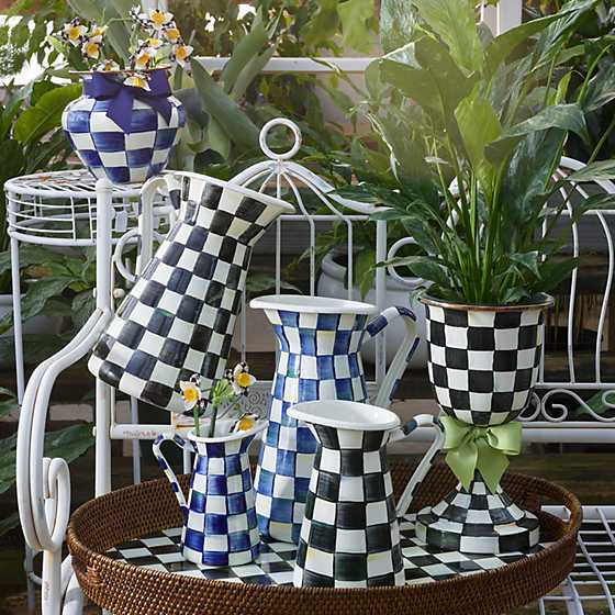 Royal Check Large Practical Pitcher among a collection of blue and black checkered enamelware.