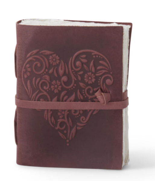 8 inch dark brown leather journal with an embossed floral heart design and a wrap-around strap.