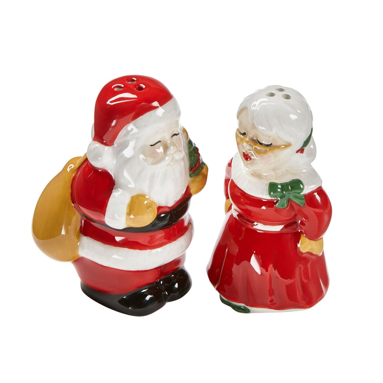 Earthenware Kissing Claus salt and pepper shakers featuring a red Santa silhouette holding hands.