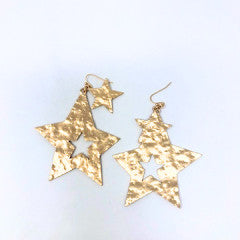 Gold metal double star dangle pierced earrings with a total length of 2.5 inches.