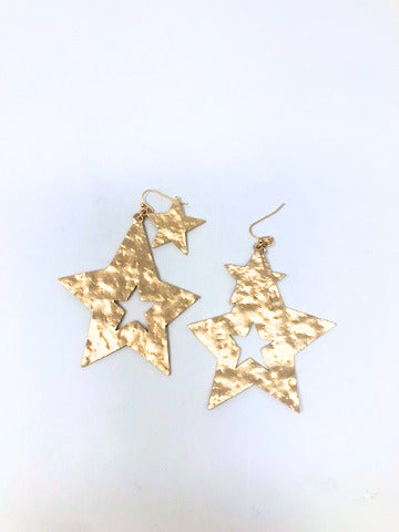 Gold metal double star dangle pierced earrings with a total length of 2.5 inches.