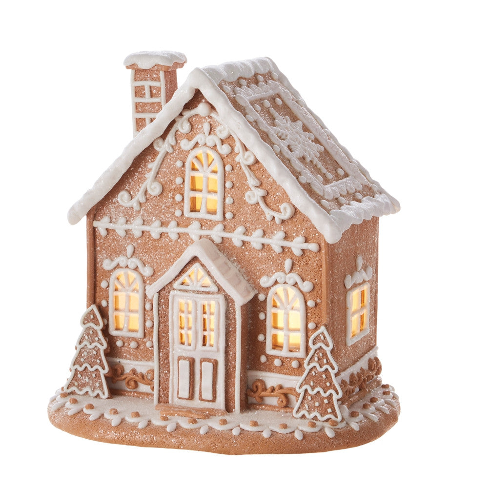 12-inch lighted gingerbread house made of clay dough with white icing details and warm glow.