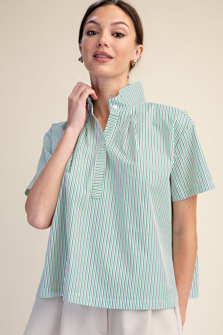 Woman wearing a Sarah Stripe Shirt with a stand collar, short sleeves, and green and white stripes.