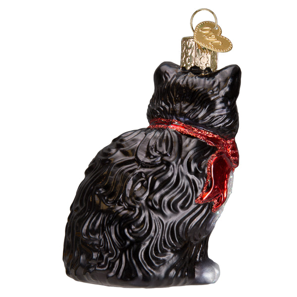 Back view of a black and white tuxedo kitty glass ornament with a red glittery bow.