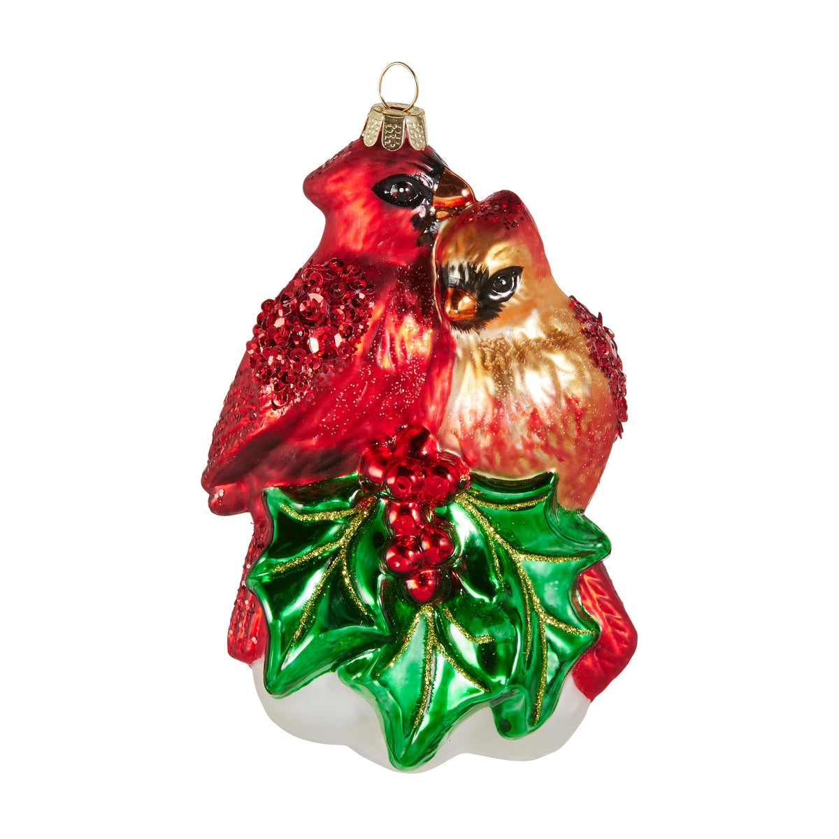 Glass Christmas ornament featuring a red male and gold female cardinal perched on holly leaves.