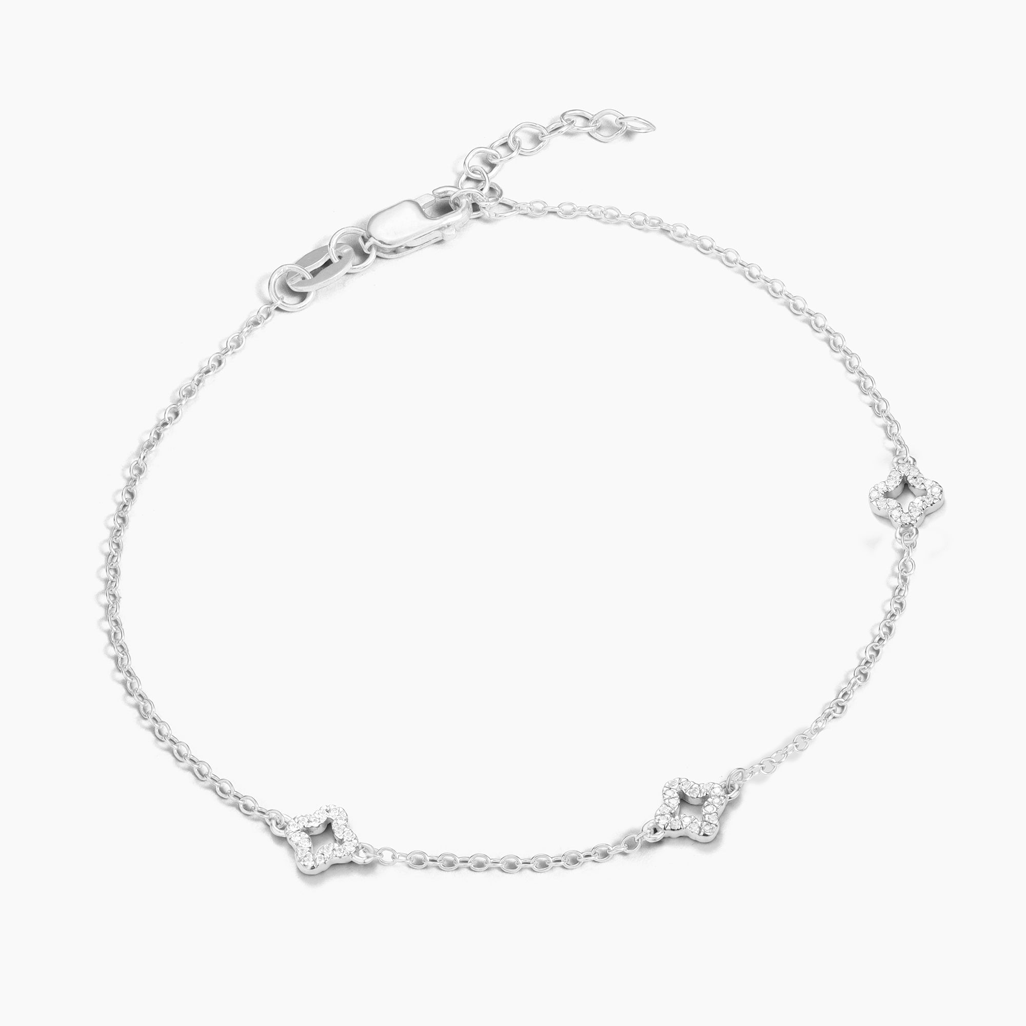 Diamond Station Chain Bracelet in silver with three diamond-studded clover charms.