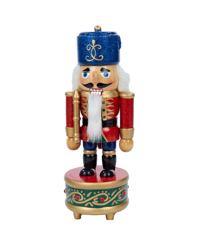 8.5-inch musical soldier nutcracker in a red uniform and blue hat, standing on a green drum base.