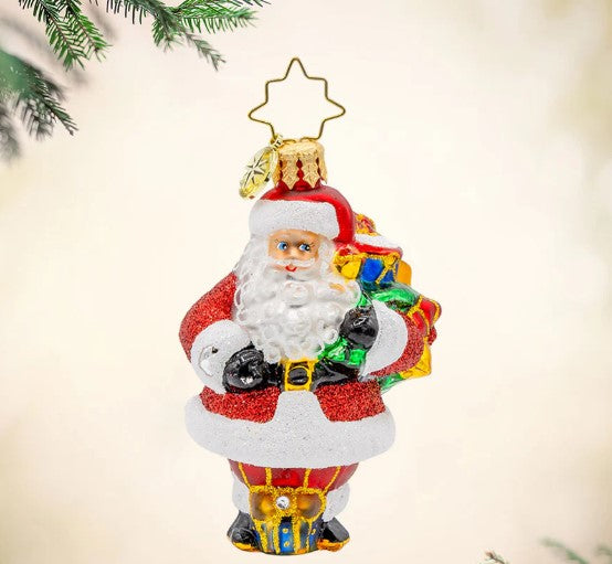 Starlit Holiday Delivery Gem glass Santa ornament with a glittery red suit and a sack of gifts.
