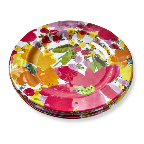 Set of white mel dinner plates featuring a delicate springtime floral pattern with pastel flowers and green leaves.
