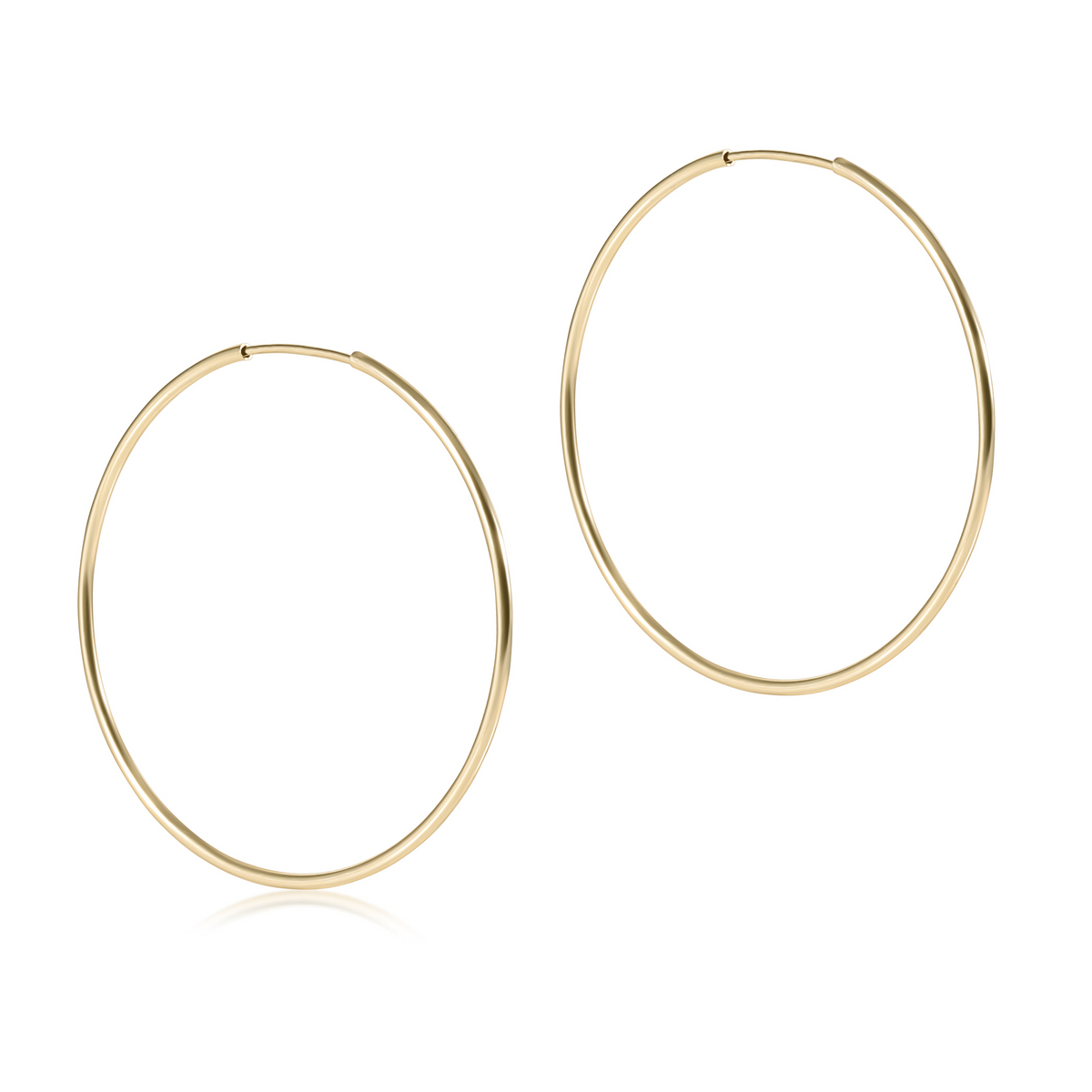 Pair of 1.25 inch 14kt gold-filled endless hoop earrings on a white background.