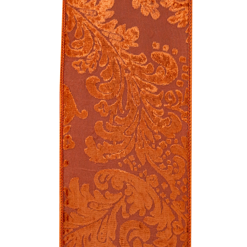 Copper velvet ribbon with a burnout filigree design and wired edges.