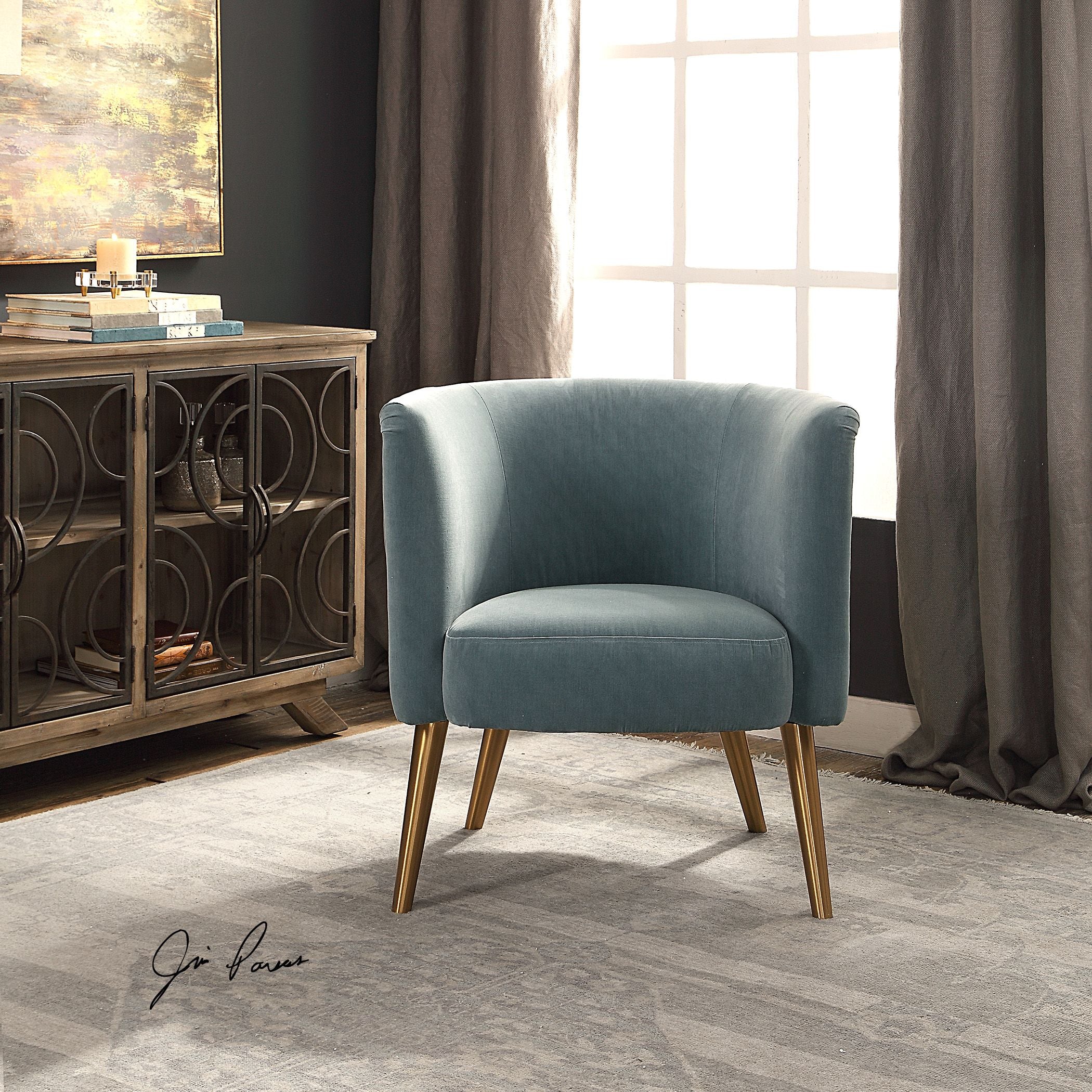 Gray Haider accent chair with a modern curved silhouette upholstered in solid fabric.