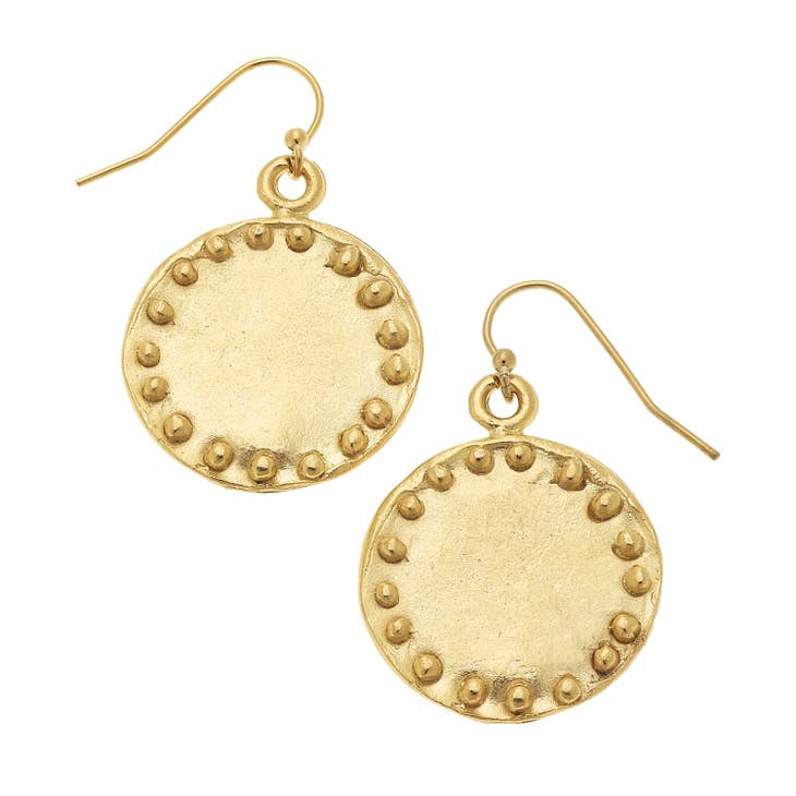 Gold circle stud earrings with dot accents on a brass base
