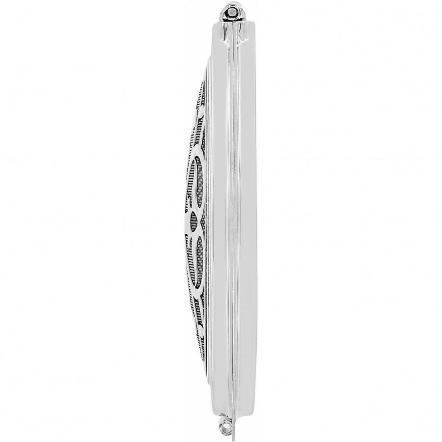 Silver plated compact mirror with pressure retractable closure and one side offering 2.5x magnification.