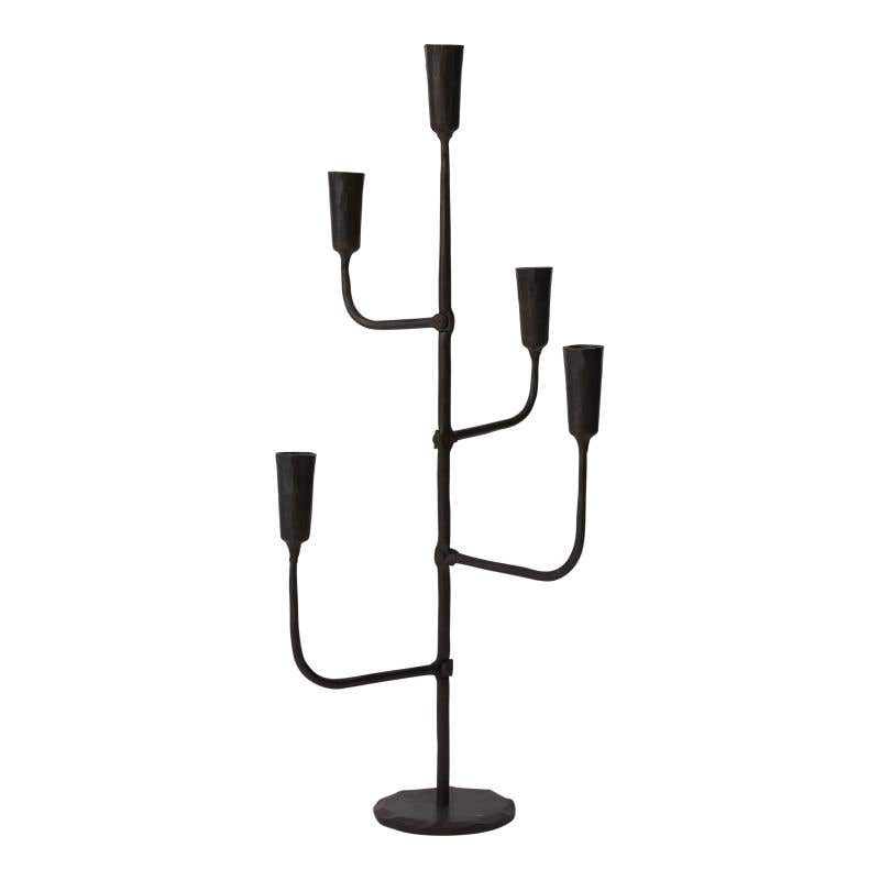 Metal Davina candelabra with a tall slender silhouette featuring three arms.