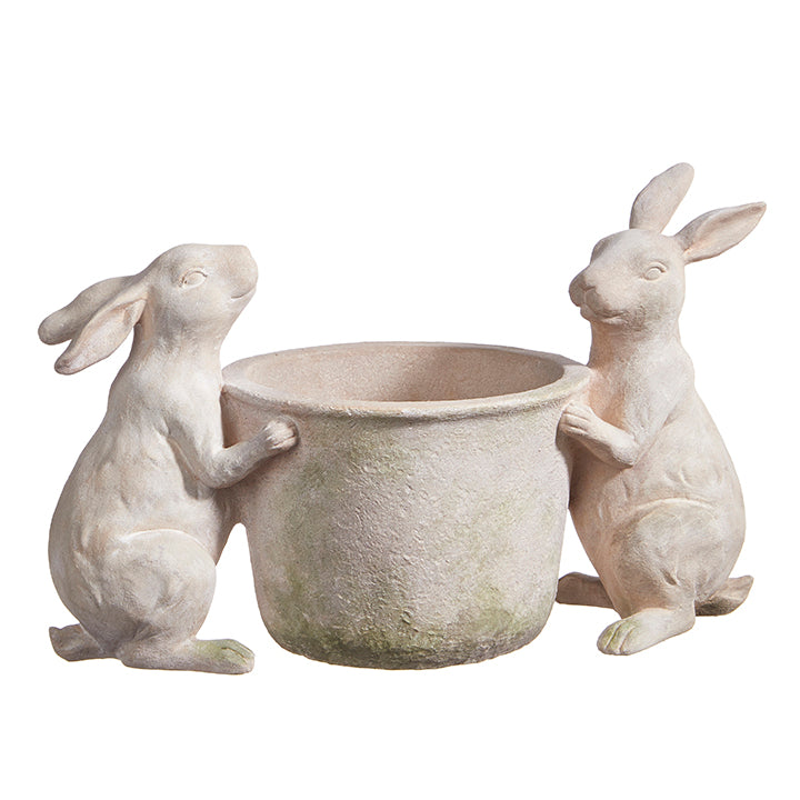 Brown resin rabbit figurine holding a flower pot