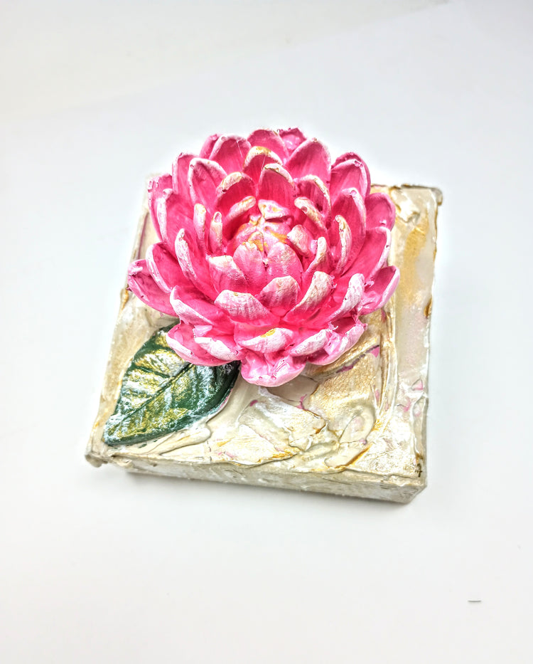 4x4 inch square clay artwork featuring a mum flower relief in earthy tones.