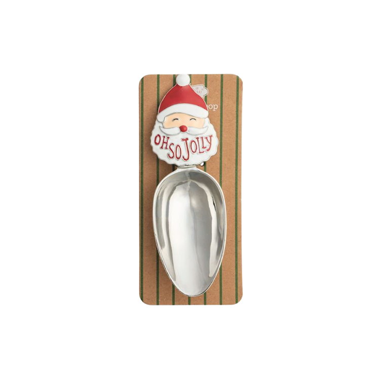 Stainless steel Christmas candy scoop with a Santa Claus enamel handle on a striped display card.