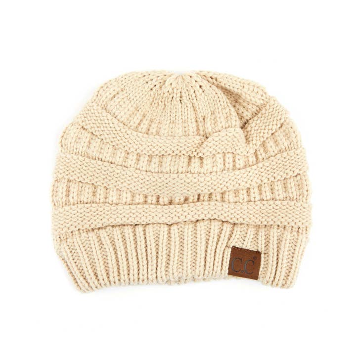 Lined beanie in black acrylic with a ribbed knit texture.