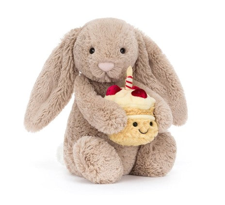 Sitting Bashful Beige bunny plush with hard eyes made of polyester.
