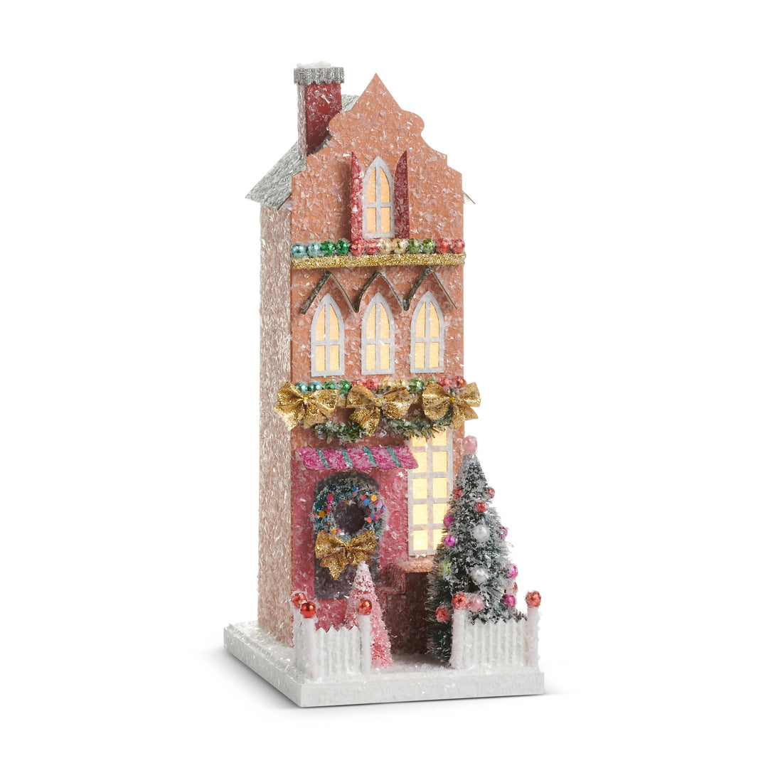 12-inch multicolored lighted paper house with glitter, gold bows, and a frosted Christmas tree.