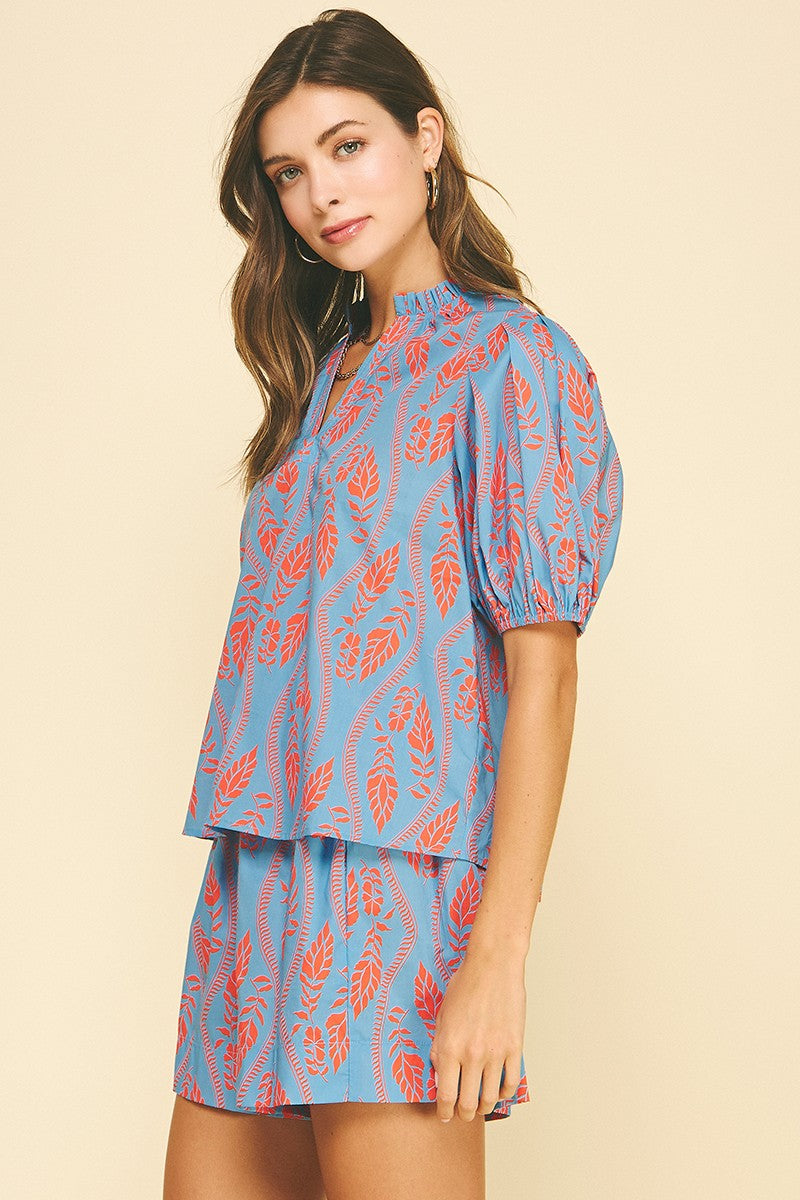 Ashley Botanical Print blouse in sky blue cotton with coral leaf block print.
