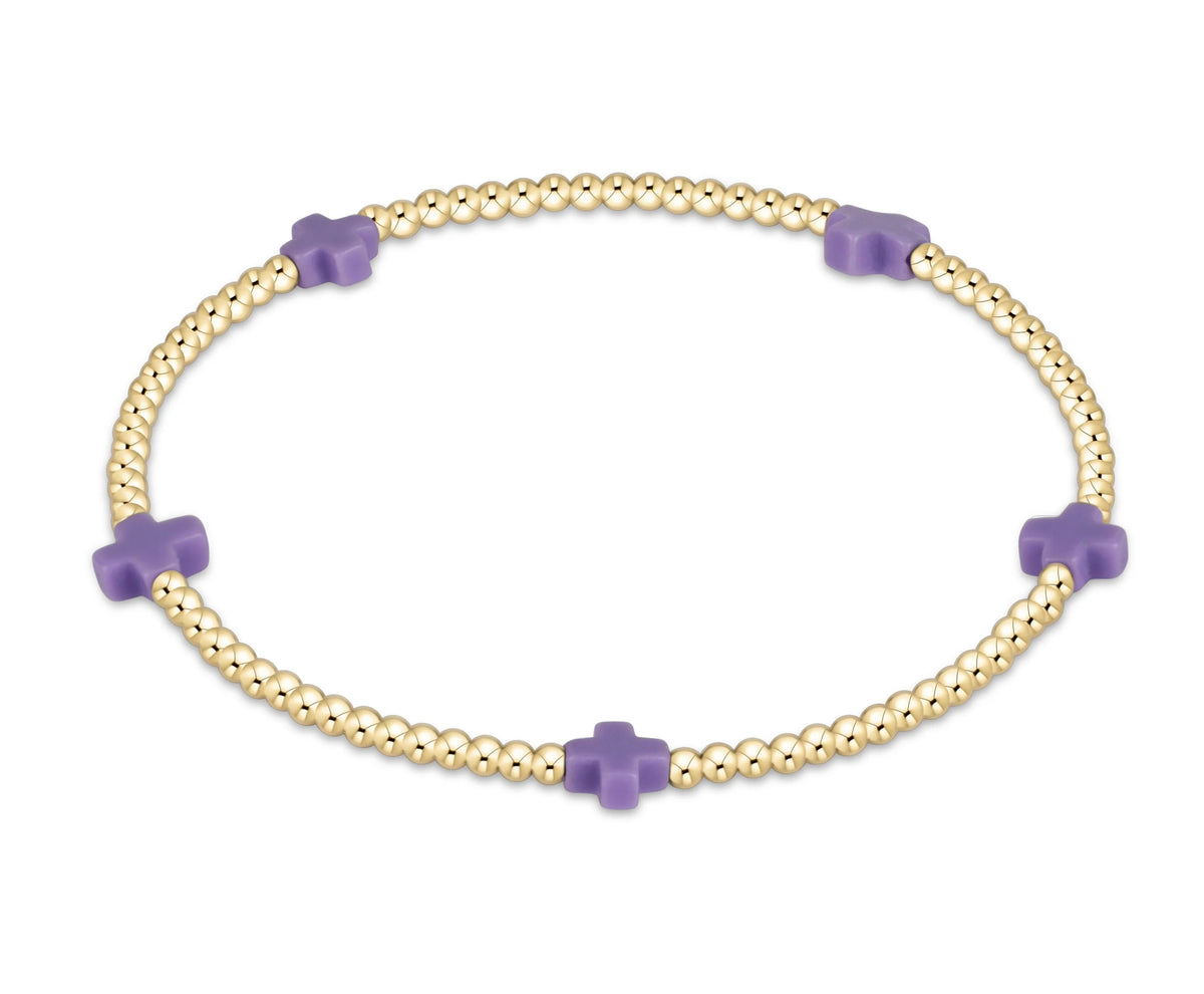 Signature Cross Small 2mm Gold Bracelet with five purple cross beads on a gold-filled bead strand.