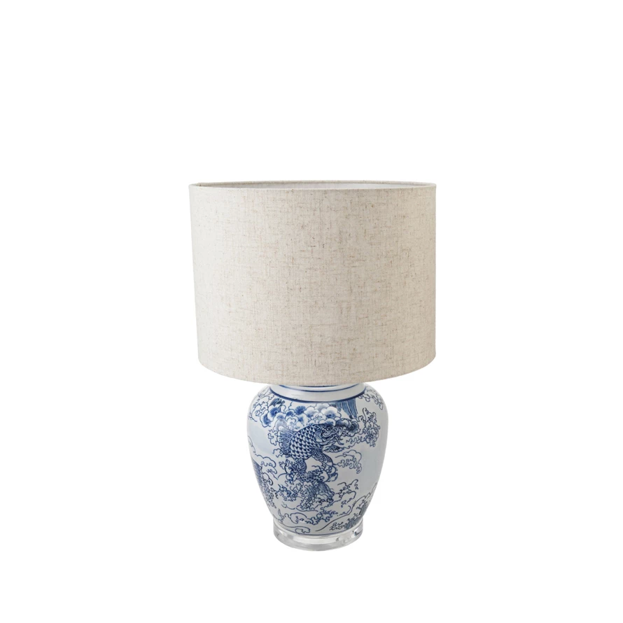 Hand-painted ceramic table lamp with a round base and cube shade in neutral tones.