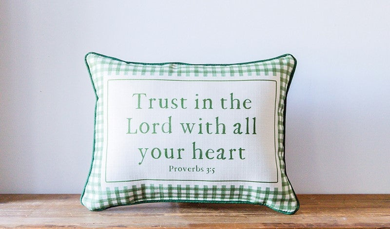 Rectangular green and white gingham pillow with 'Trust in the Lord with all your heart' text.