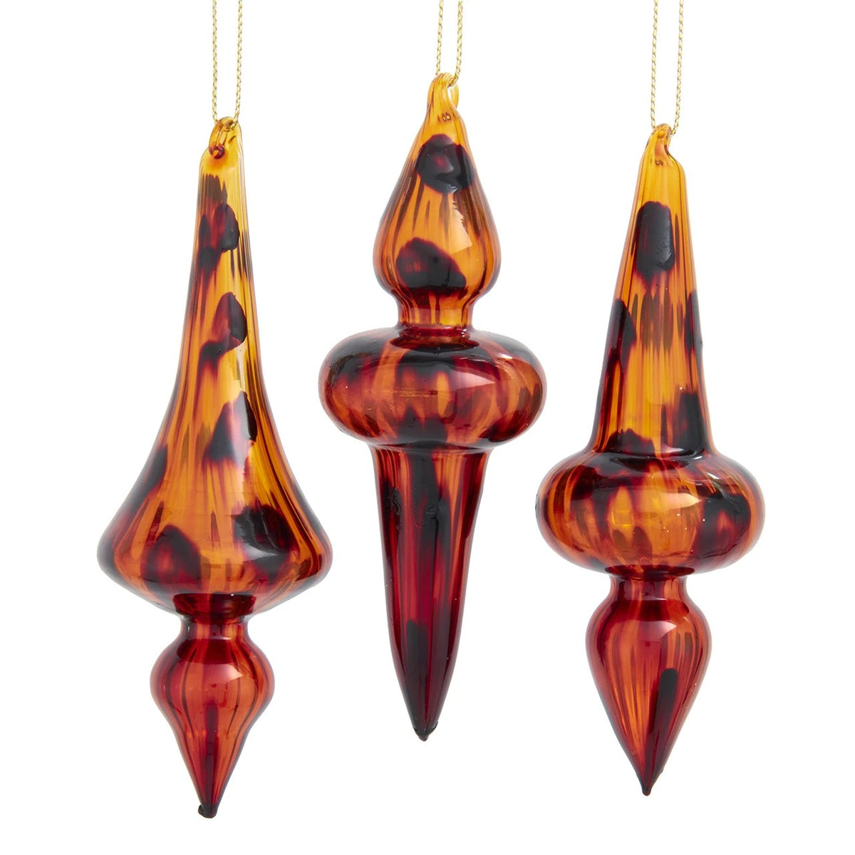 Three glass finial ornaments with a rich amber and brown tortoise shell marbled finish.