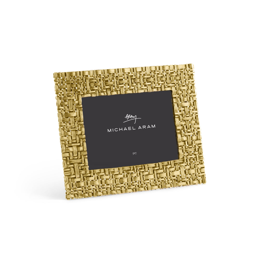 Antique goldtone palm leaf frame with sculpted texture in vertical orientation.