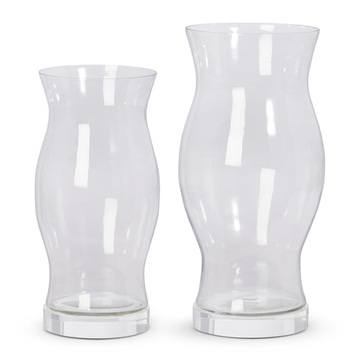 Glass hurricane container with a cylindrical shape.