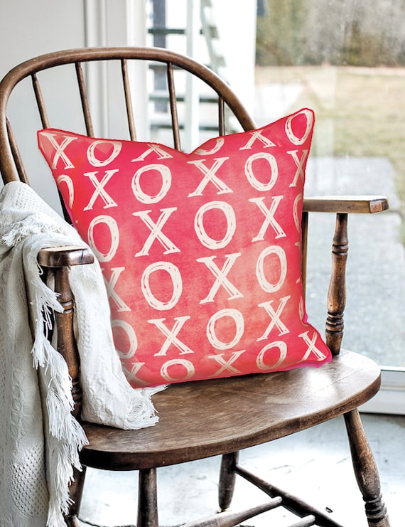 Red XOXO Pattern decorative pillow featuring original artwork by Rachel Brooks Design with hand-pressed sublimation print.