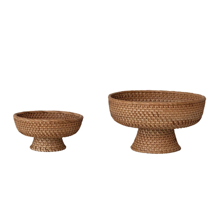 Two round footed rattan bowls in natural color with a woven texture.