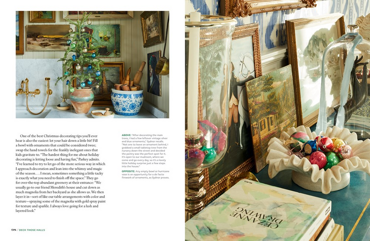 Magazine spread featuring festive holiday decor with vintage ornaments, small trees, and artwork.