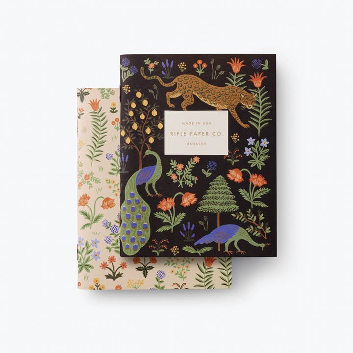 Pair of saddle-stitched pocket notebooks with uncoated natural vellum covers featuring metallic gold foil accents.