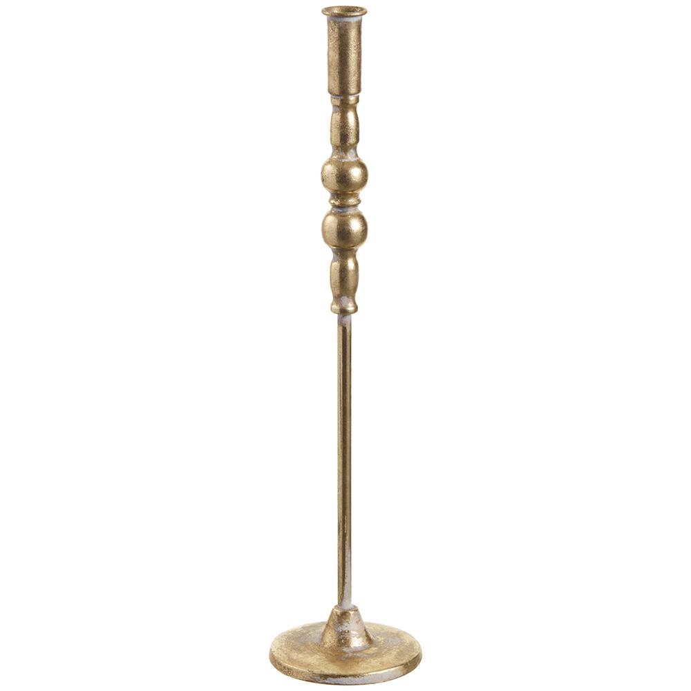 Antique gold metal tapper holder with a curved handle.