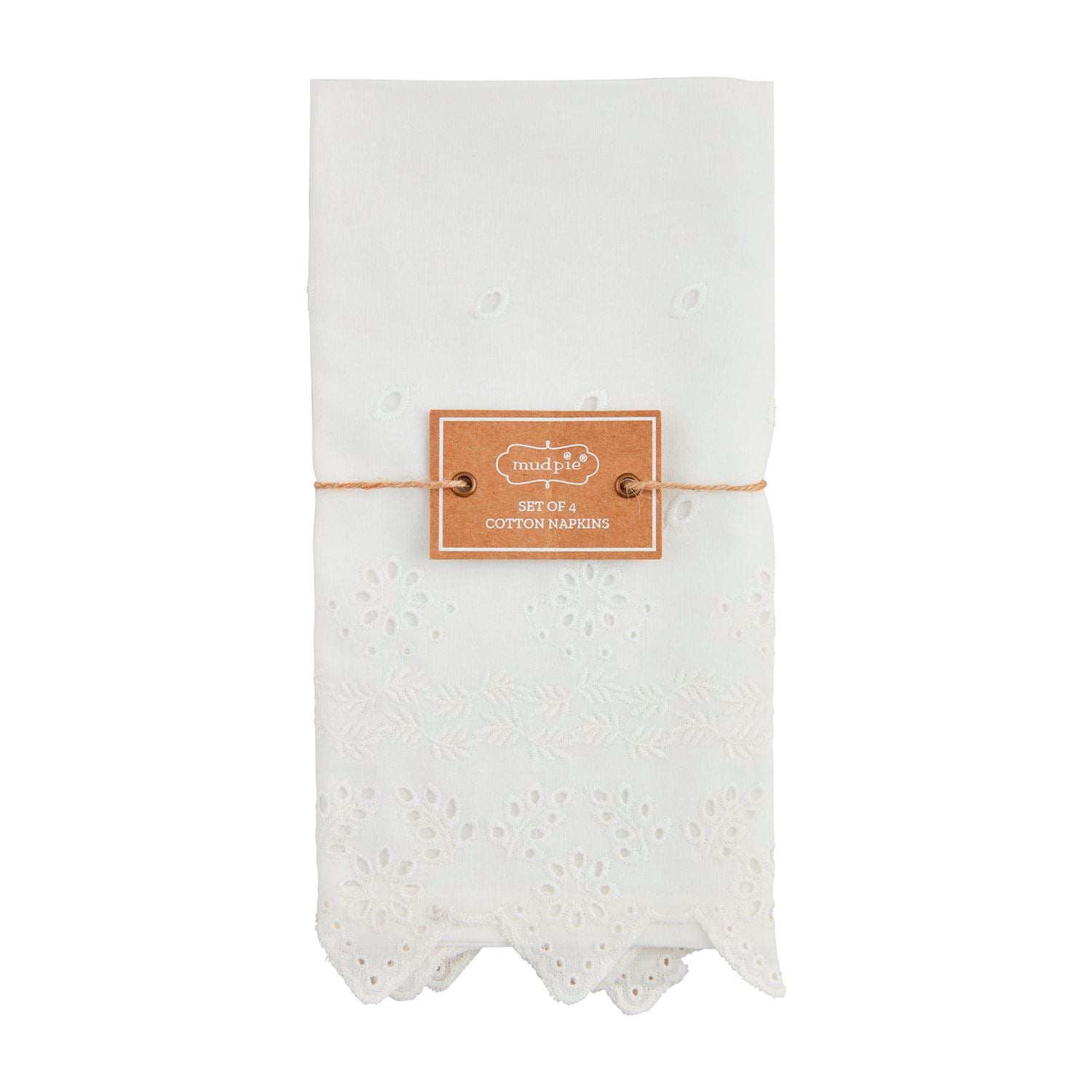 Set of four white cotton napkins with decorative eyelet embroidery and scalloped edges.