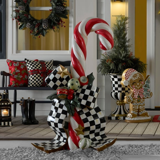 60-inch glossy resin candy cane trophy with red-and-white stripes on a black base.