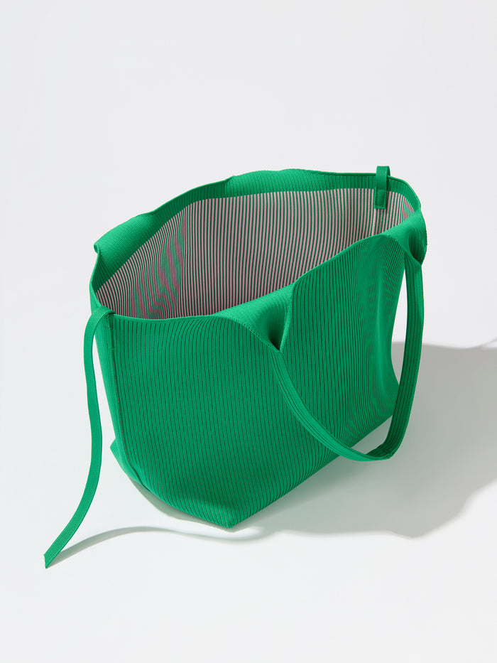 Robbie Tote in Fern green, a ribbed knit shoulder bag with a spacious interior and tie closure.