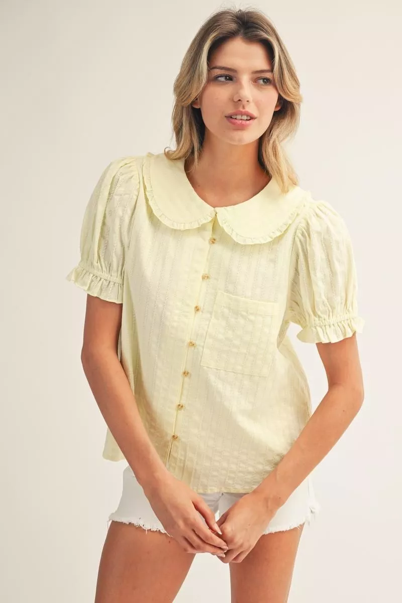 Madeline Peter Pan collared button down top in yellow with short puff sleeves and ruffle detail.