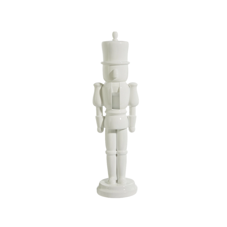 22.5-inch tall decorative nutcracker figurine in a solid glossy white finish made of resin.