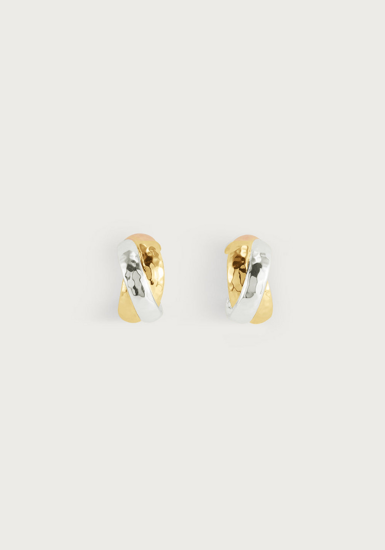 Farrier Triple Huggie Hoop Earrings featuring interlocking hammered gold and silver bands.