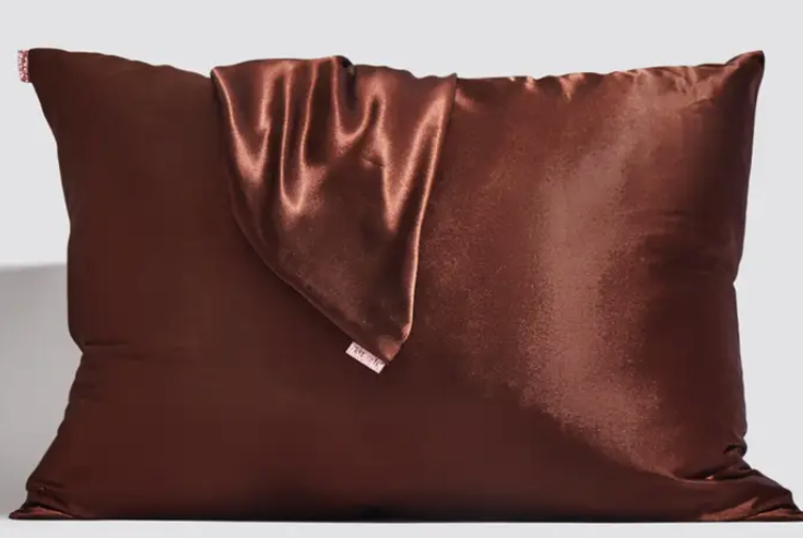 Satin pillowcase in a soft neutral tone with smooth texture.