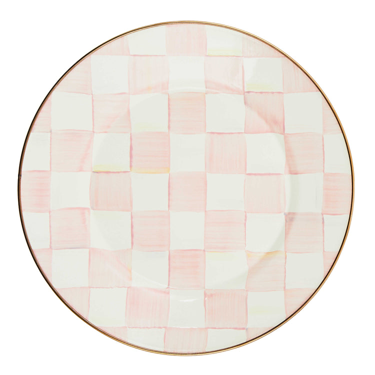 Round enamel dinner plate with a hand-painted pink and white checkered pattern and a bronze rim.