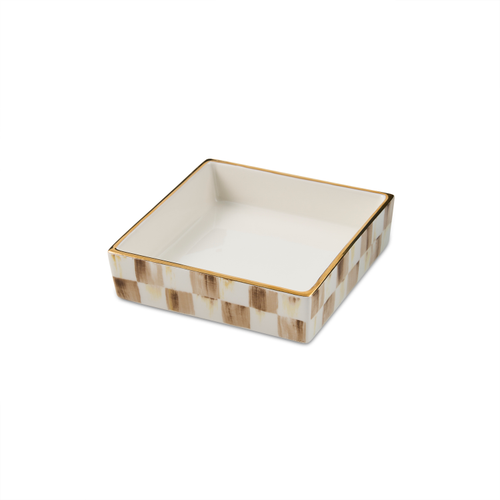 Square ceramic cocktail napkin holder with a gray and white checkered pattern and gold rim.